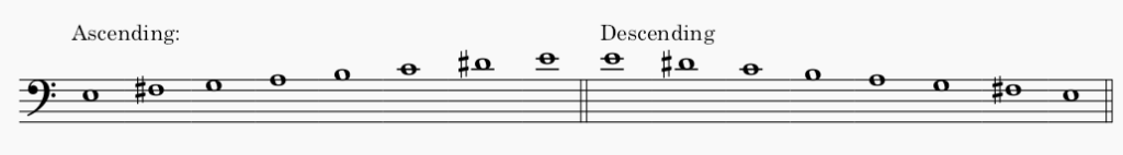 E minor harmonic minor scale in bass clef - both ascending and descending scale.
